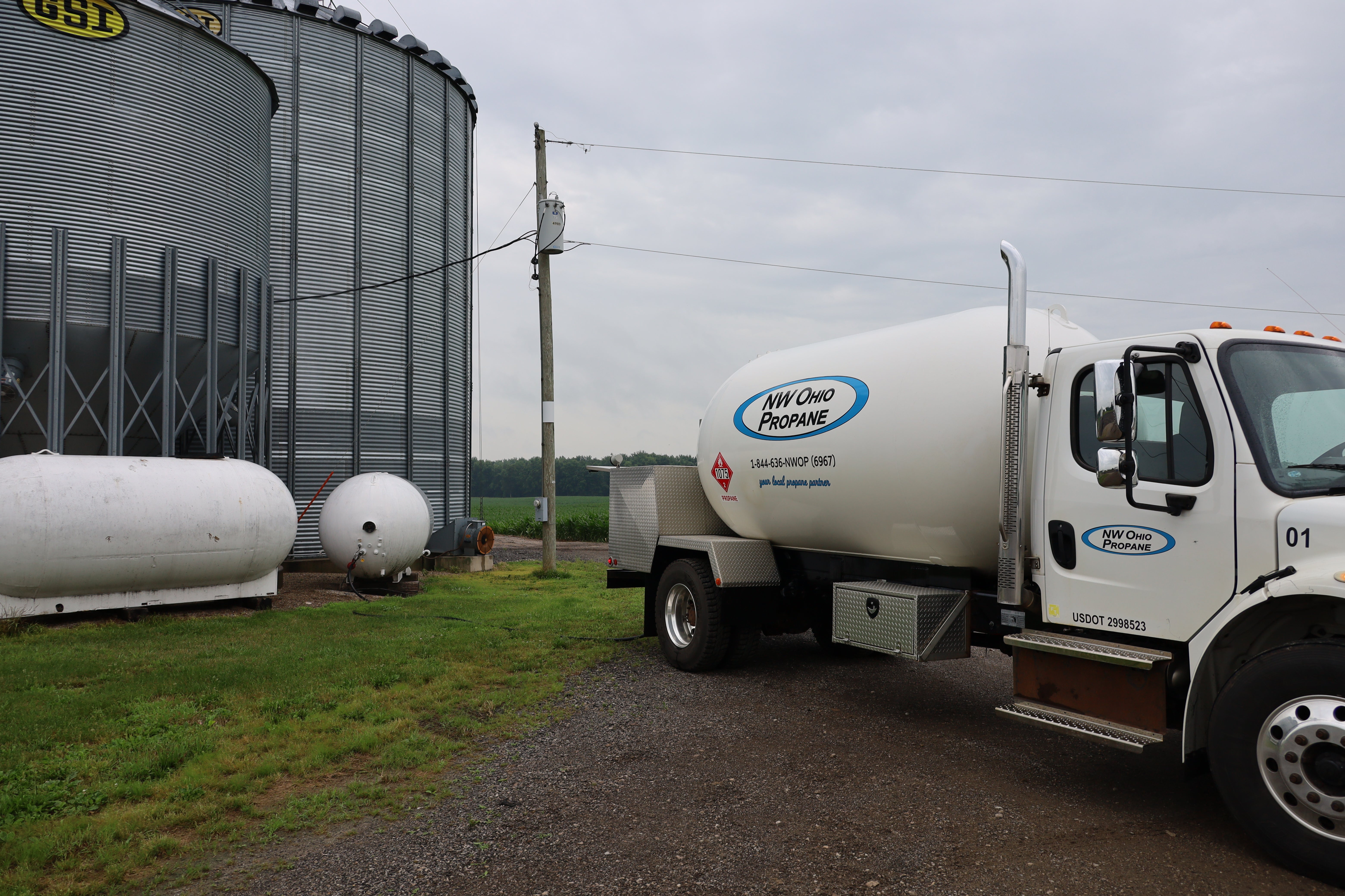 propane truck by grain bins